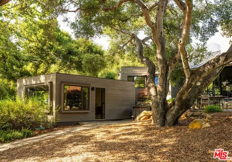 a backyard of a house with lots of green space