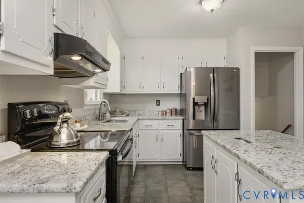 a kitchen with a sink stove and refrigerator