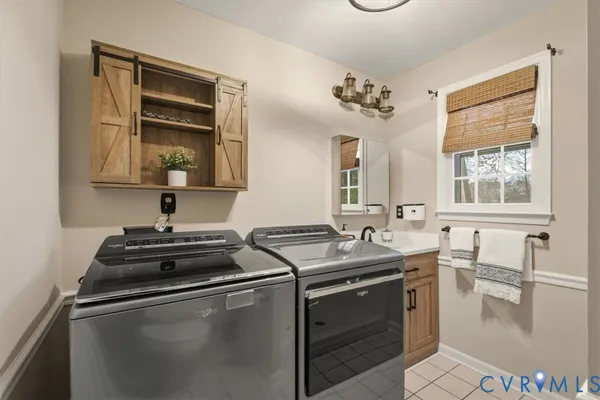 a kitchen with a sink appliances and cabinets