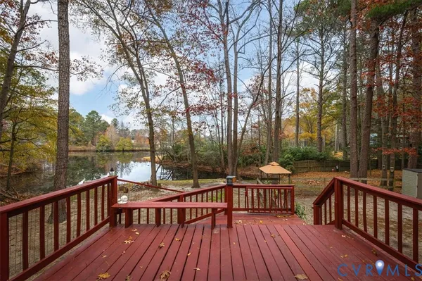 a view of a wooden deck with trees
