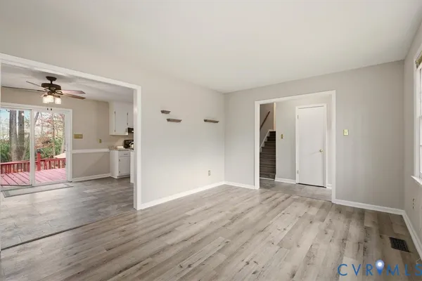 a view of livingroom with hardwood floor and a ceiling fan