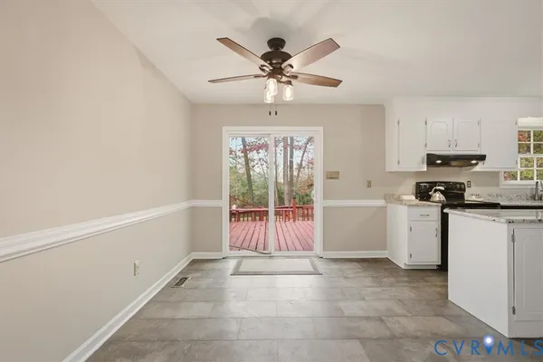 a open kitchen with a sink and white cabinets