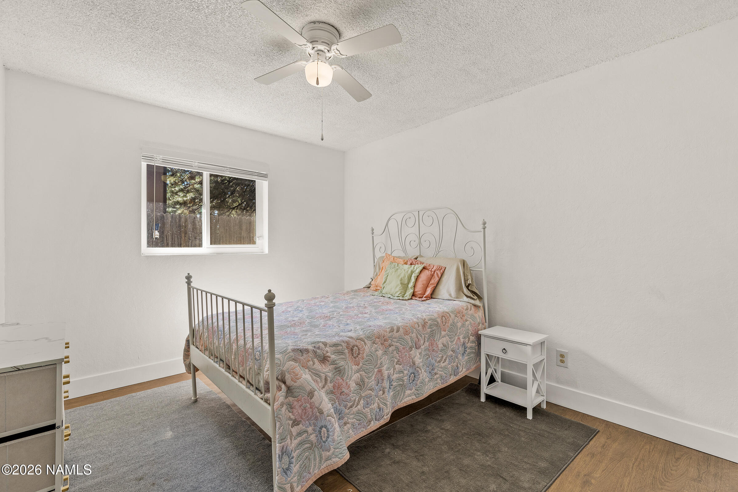 4367 East Hollygreen Road Flagstaff, AZ 86004 - Photo 13 of 21 a bedroom with a bed and a chandelier