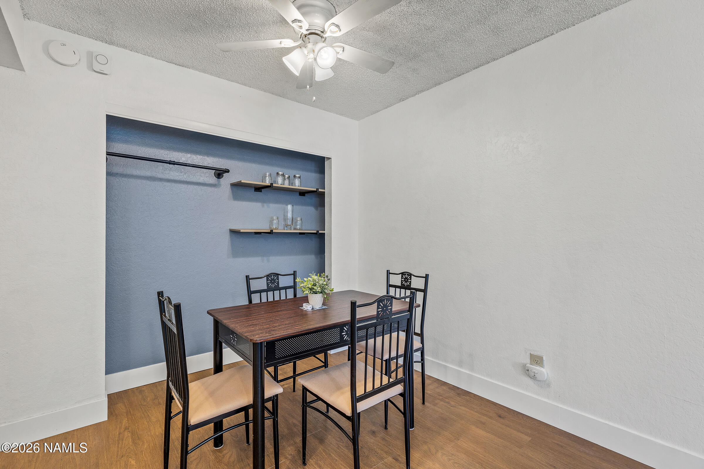 4367 East Hollygreen Road Flagstaff, AZ 86004 - Photo 7 of 21 a view of a dining room with furniture and wooden floor