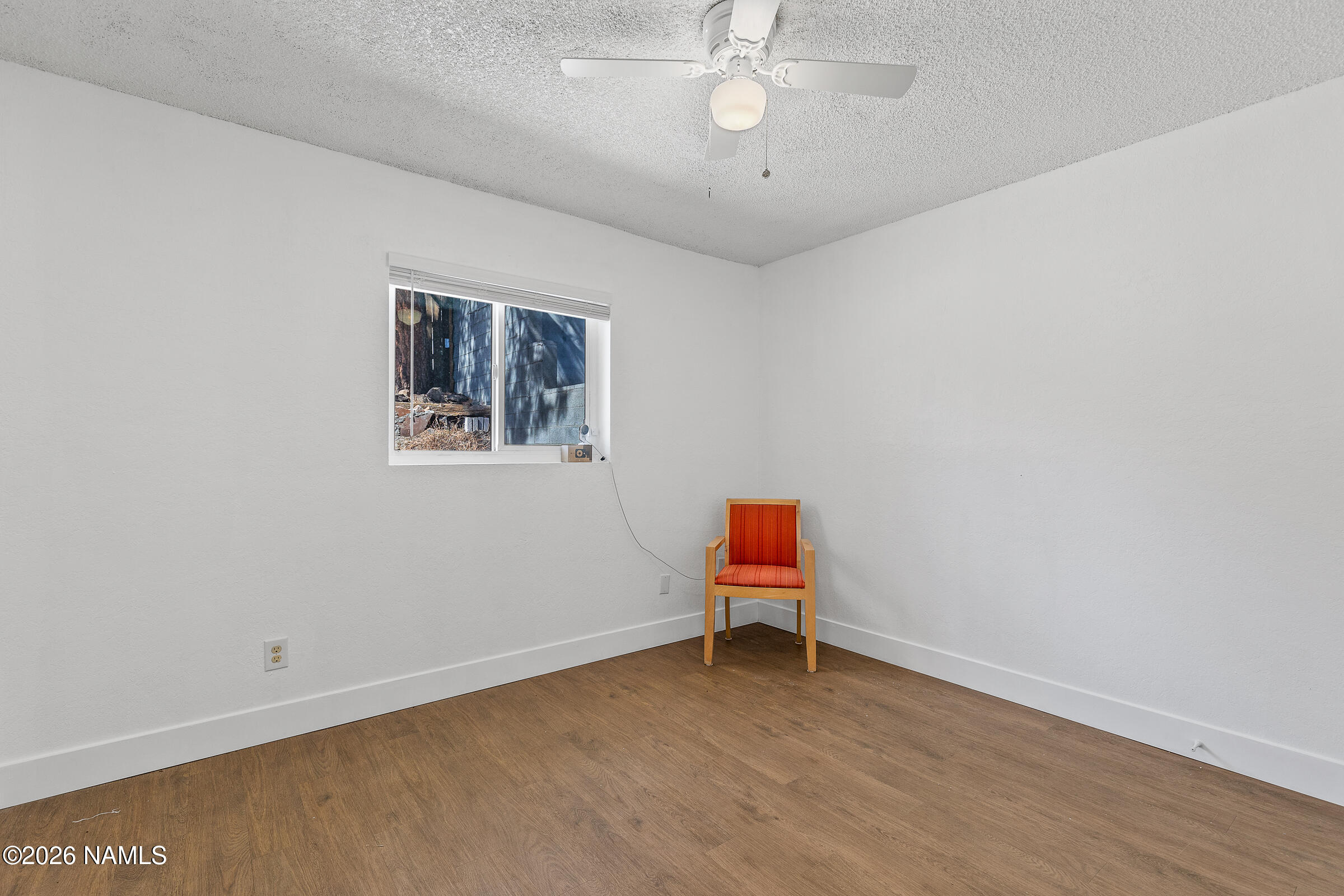 4367 East Hollygreen Road Flagstaff, AZ 86004 - Photo 8 of 21 a view of a room with wooden floor and fan