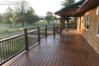 143 Ring Road Guffey, CO 80820 - Photo 26 of 36 View of new wrap-around deck with built-in solar lighting