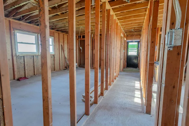 a view of hallway with wooden walls