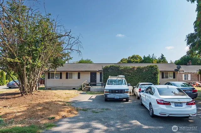 a front view of a house with parking space