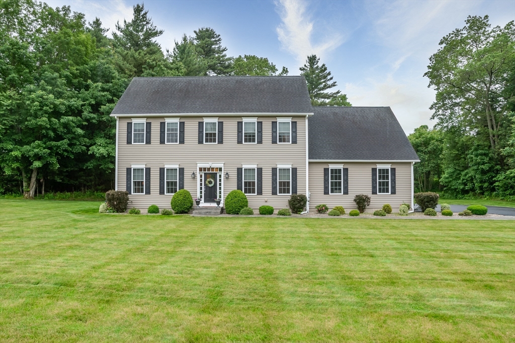 7 Red Gap Road Wilbraham, MA 01095 - Photo 1 of 31 a front view of a house with a garden and trees