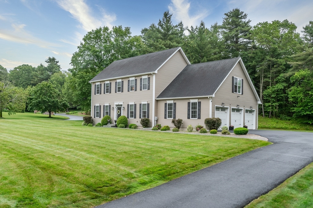 7 Red Gap Road Wilbraham, MA 01095 - Photo 2 of 31 a front view of a house with a yard