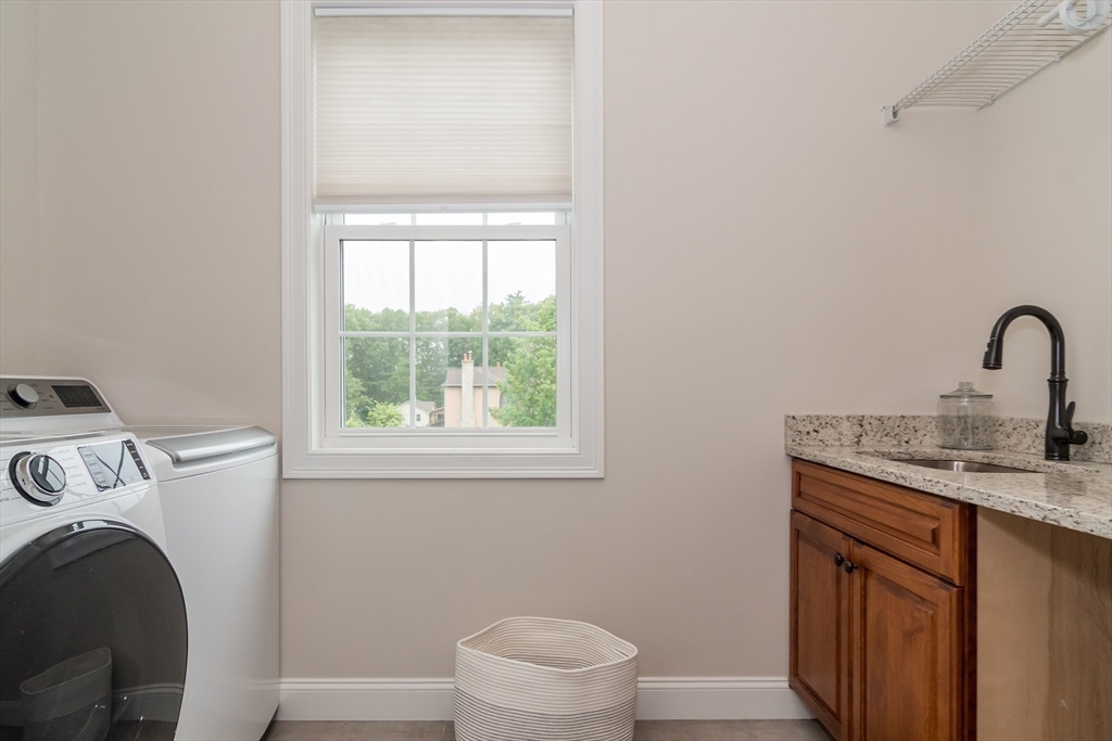 7 Red Gap Road Wilbraham, MA 01095 - Photo 21 of 31 a bathroom with a sink a toilet and a window