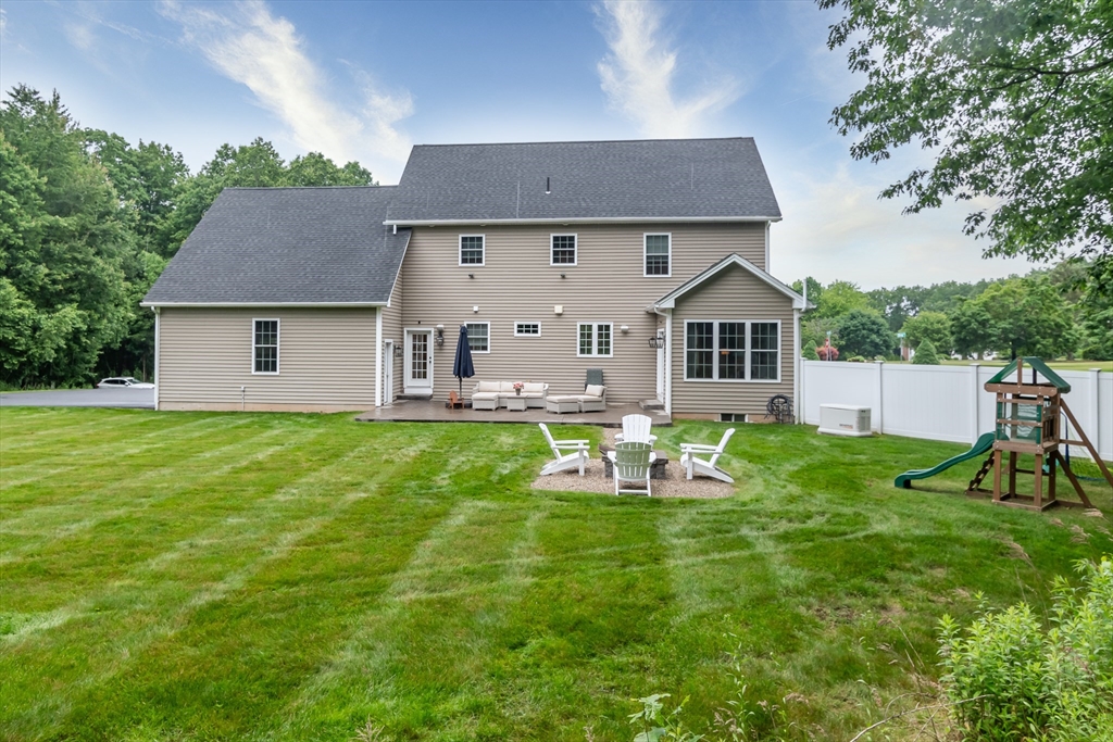 7 Red Gap Road Wilbraham, MA 01095 - Photo 30 of 31 a front view of a house with a yard table and chairs