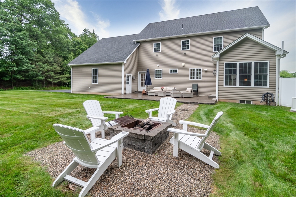 7 Red Gap Road Wilbraham, MA 01095 - Photo 31 of 31 a view of a house with backyard sitting area and garden