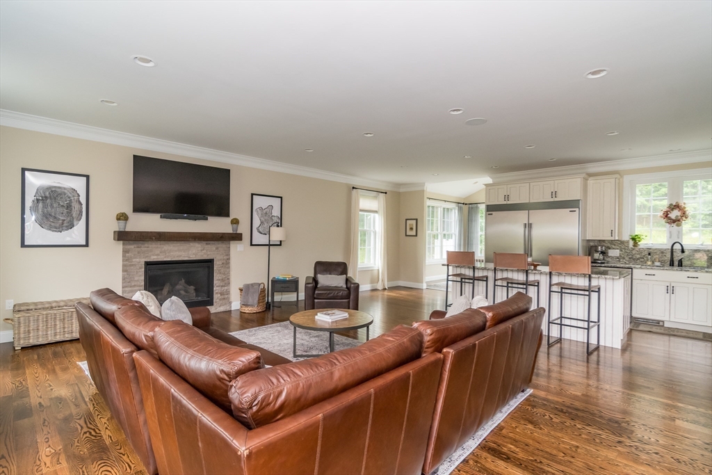7 Red Gap Road Wilbraham, MA 01095 - Photo 7 of 31 a living room with furniture a fireplace and a flat screen tv