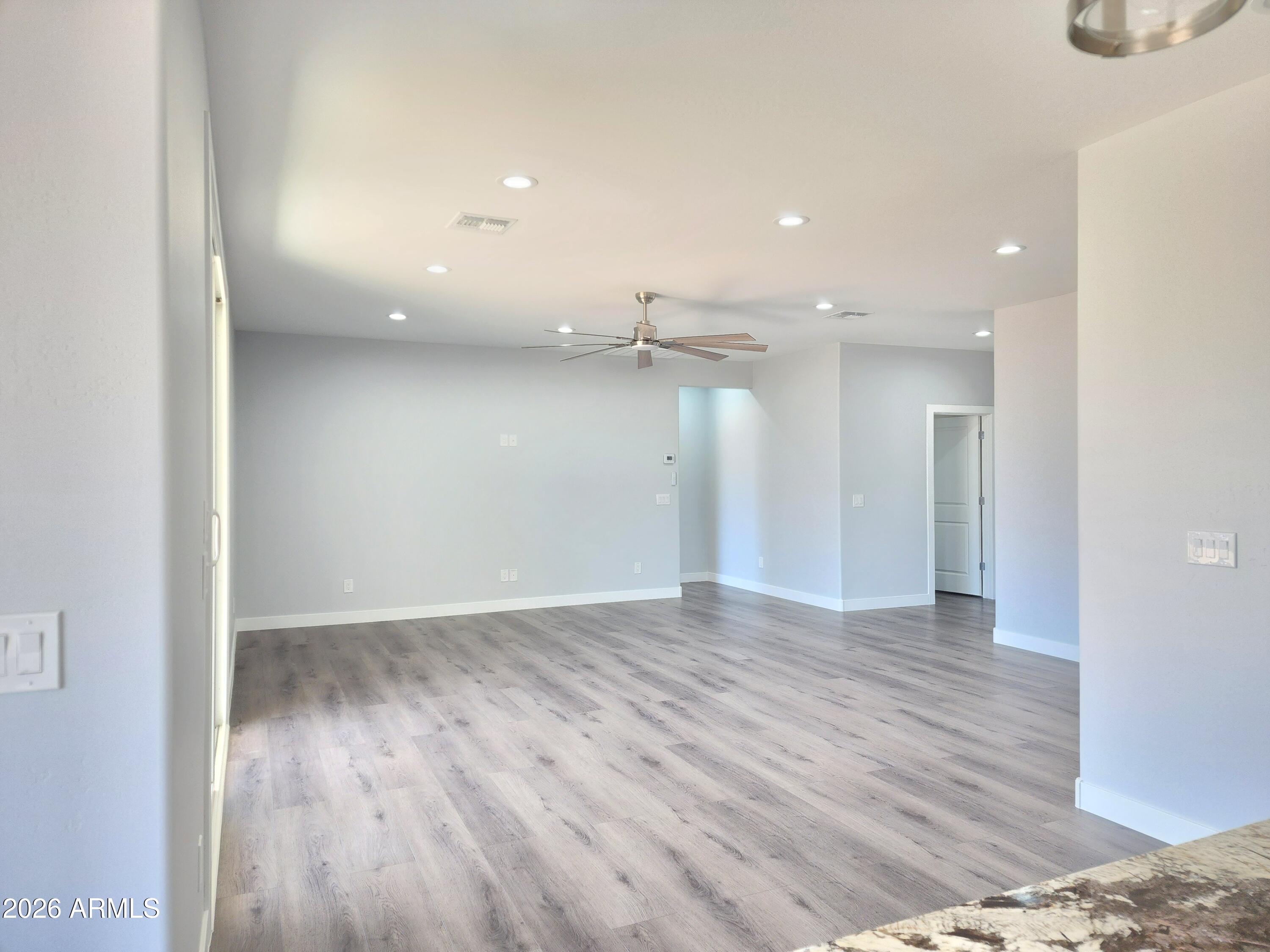 13564 South Durango Road Arizona City, AZ 85123 - Photo 22 of 30 a view of an empty room with wooden floor