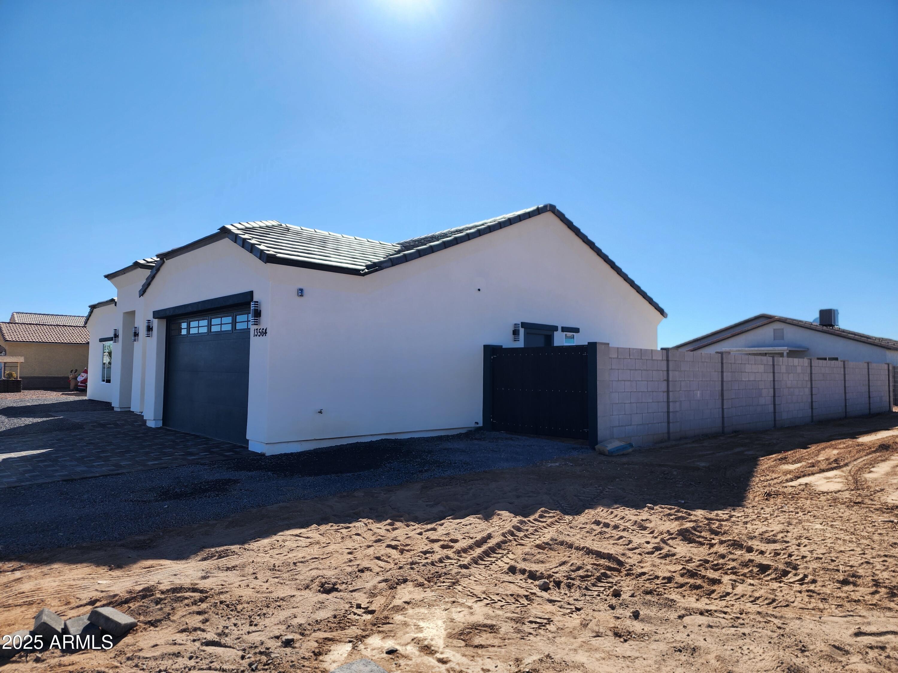 13564 South Durango Road Arizona City, AZ 85123 - Photo 4 of 30 a house view with a outdoor space