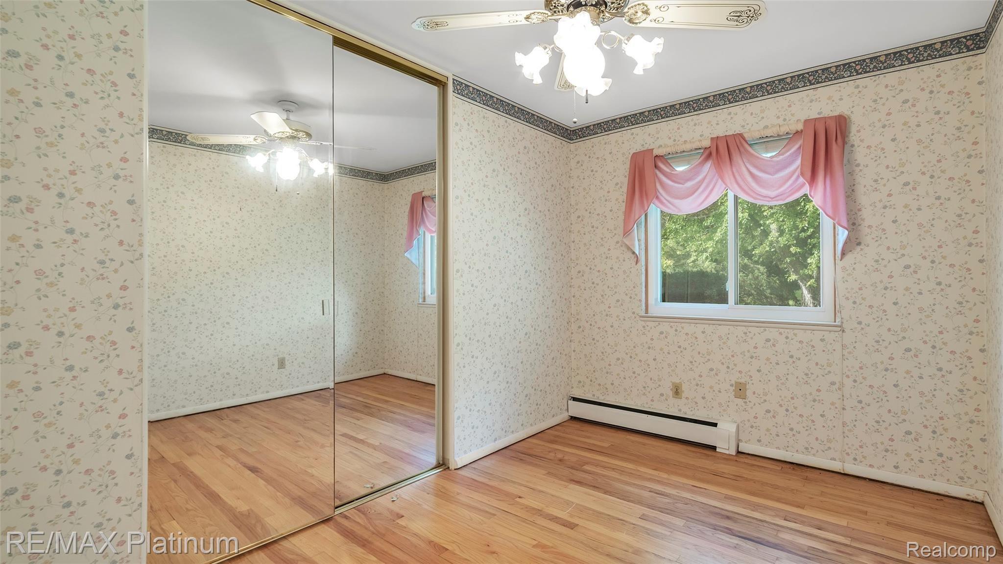 2966 Swarthout Road Pinckney, MI 48169 - Photo 16 of 42 Hardwood Floors In First Floor Bedroom 1