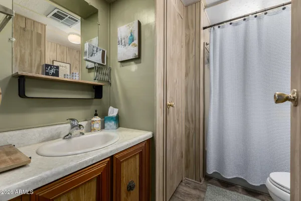 a bathroom with a sink and mirror