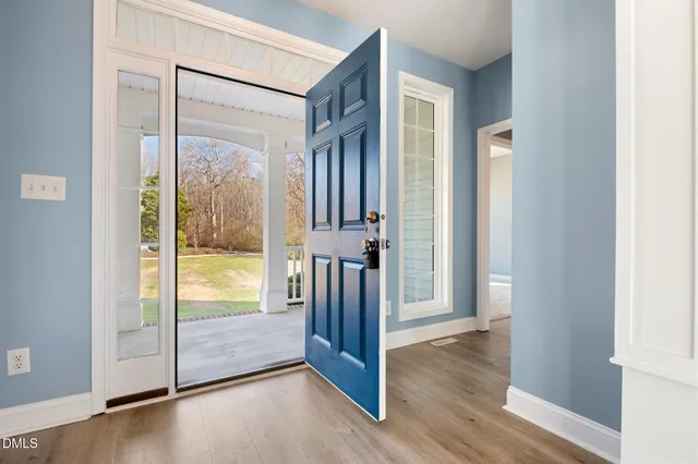 a view of a patio with couches chairs and a fire pit