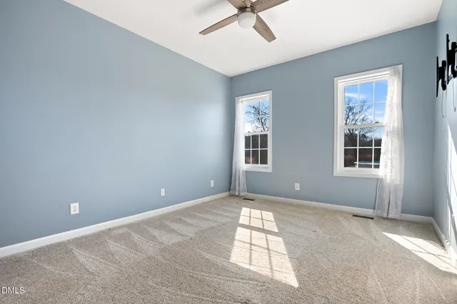 a bathroom with a sink a mirror a vanity and a shower
