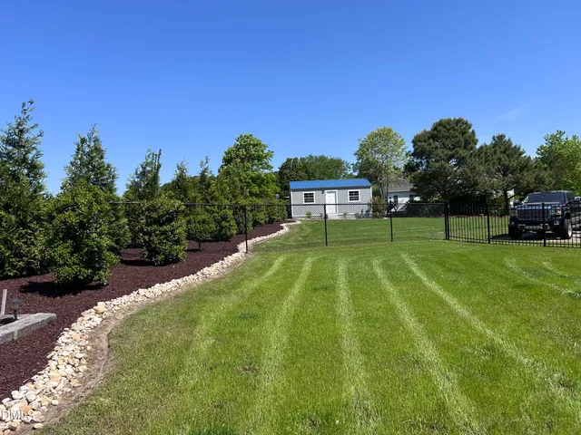 a view of a yard in front of a house
