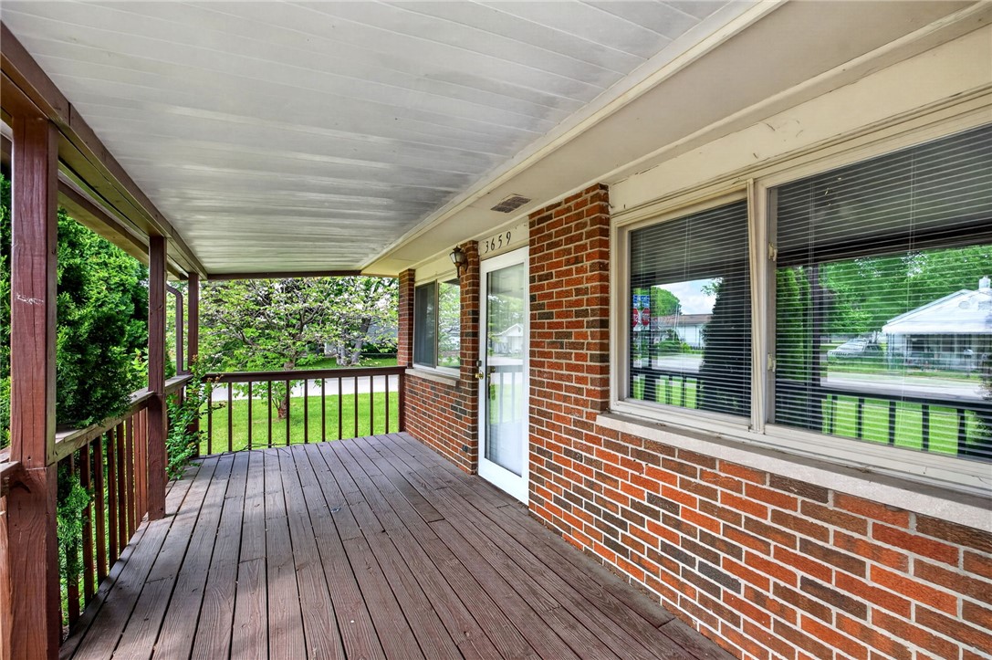 3659 Trail-On Road Dayton, OH 45439 - Photo 6 of 38 Welcome to a charming brick residence featuring a spacious covered porch and inviting outdoor spaces.
