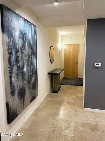 a view of a room with wooden floor and glass door