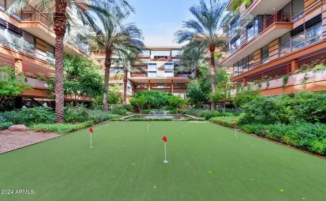a view of a house with a yard and tree s