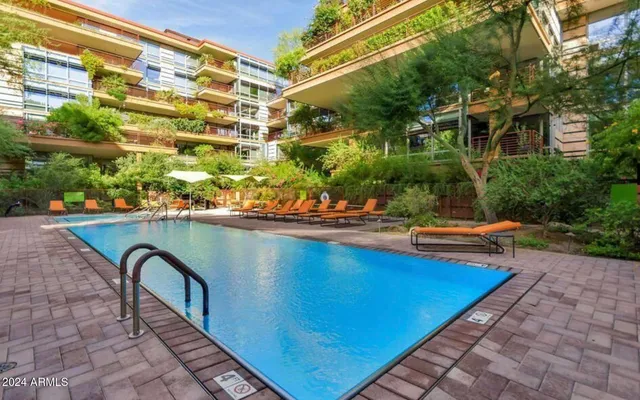 a view of swimming pool from a balcony