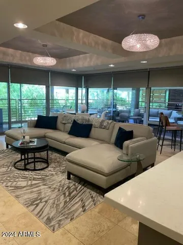 a living room with furniture and a large window