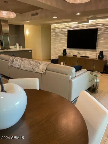 a view of a livingroom with workspace and a couch