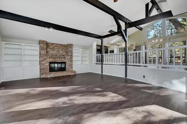 a bathroom with a granite countertop sink mirror and toilet