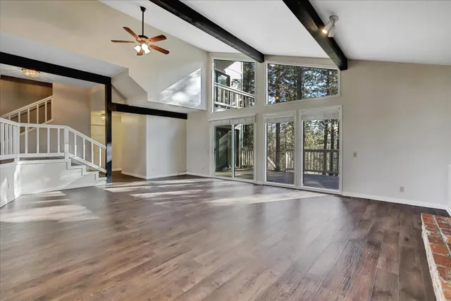 a bathroom with a granite countertop sink and mirror