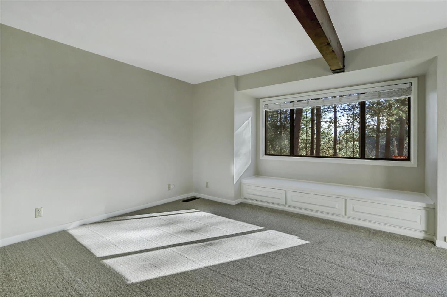 15017 Pammy Way Grass Valley, CA 95949 - Photo 20 of 99 a view of an empty room with wooden floor and a window
