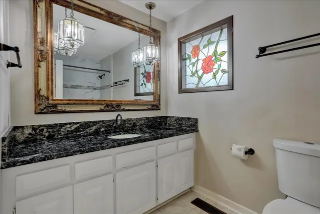 a view of an empty room with windows