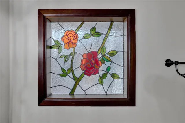 a bathroom with a glass shower door and a mirror