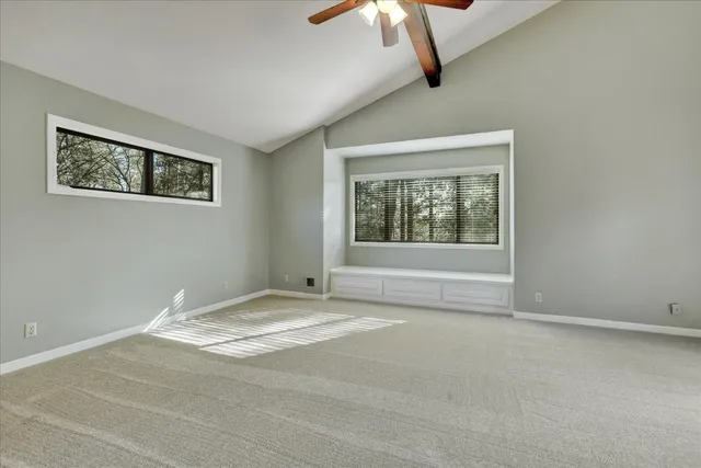 a view of a city with green field