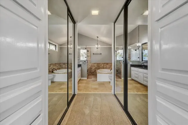 a view of a balcony with wooden floor and fence