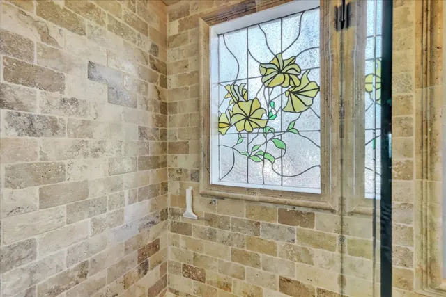 a view of residential houses with outdoor space and trees