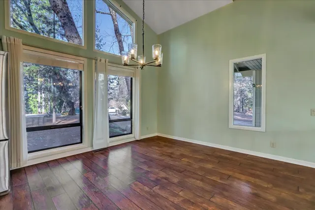 a view of a livingroom with an empty space and a fireplace