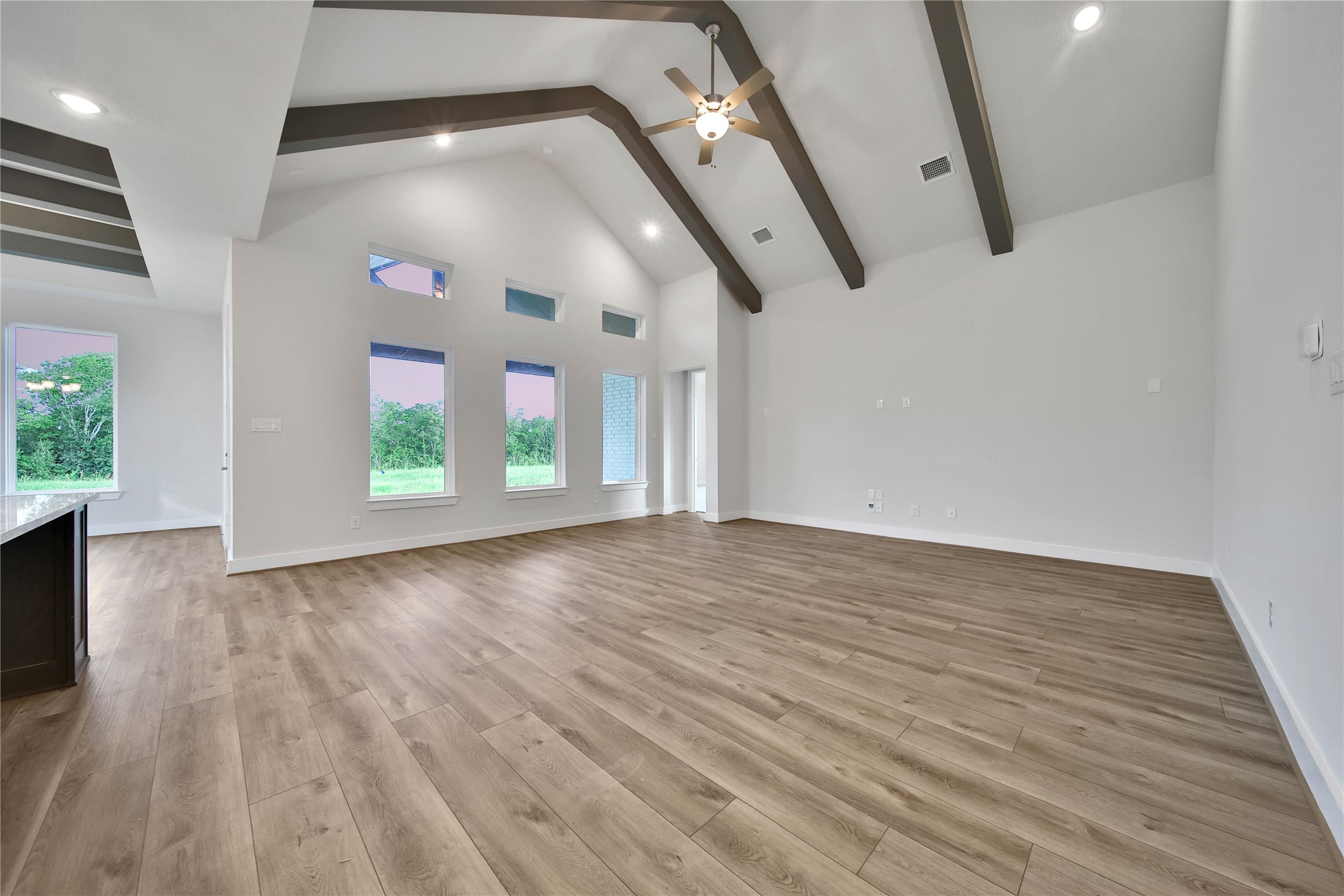 4602 Magnolia Bend Drive Rosharon, TX 77583 - Photo 4 of 39 an empty room with wooden floor and windows
