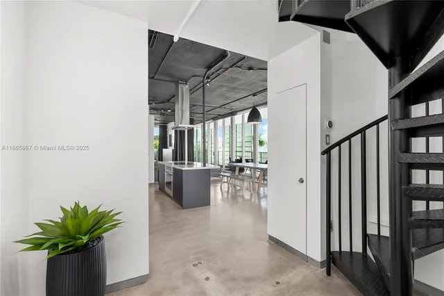 a large kitchen with stainless steel appliances granite countertop a stove and a refrigerator