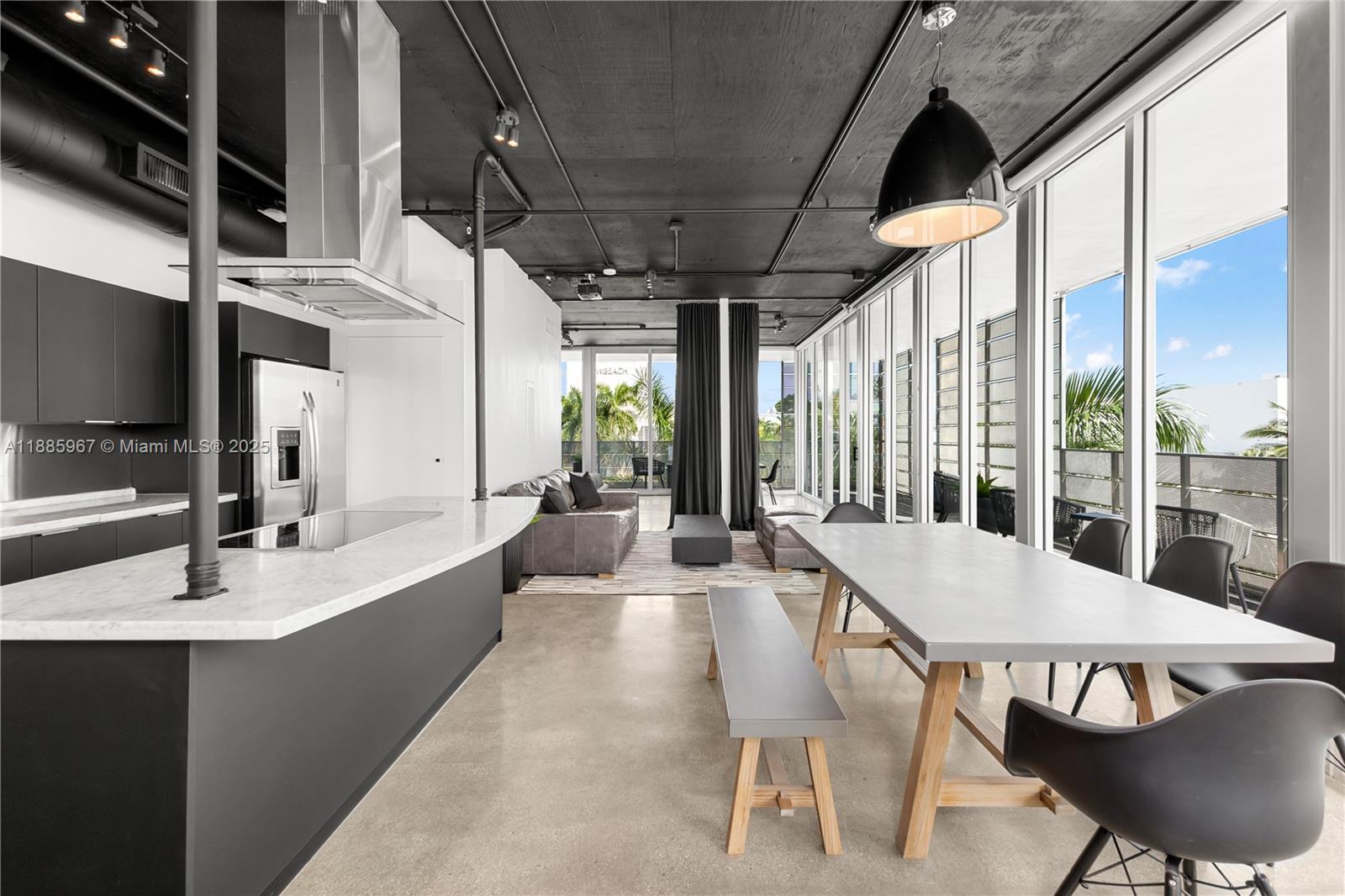 1700 Meridian Avenue, Unit 501 Miami Beach, FL 33139 - Photo 19 of 57 a view of a dining room with furniture window and wooden floor
