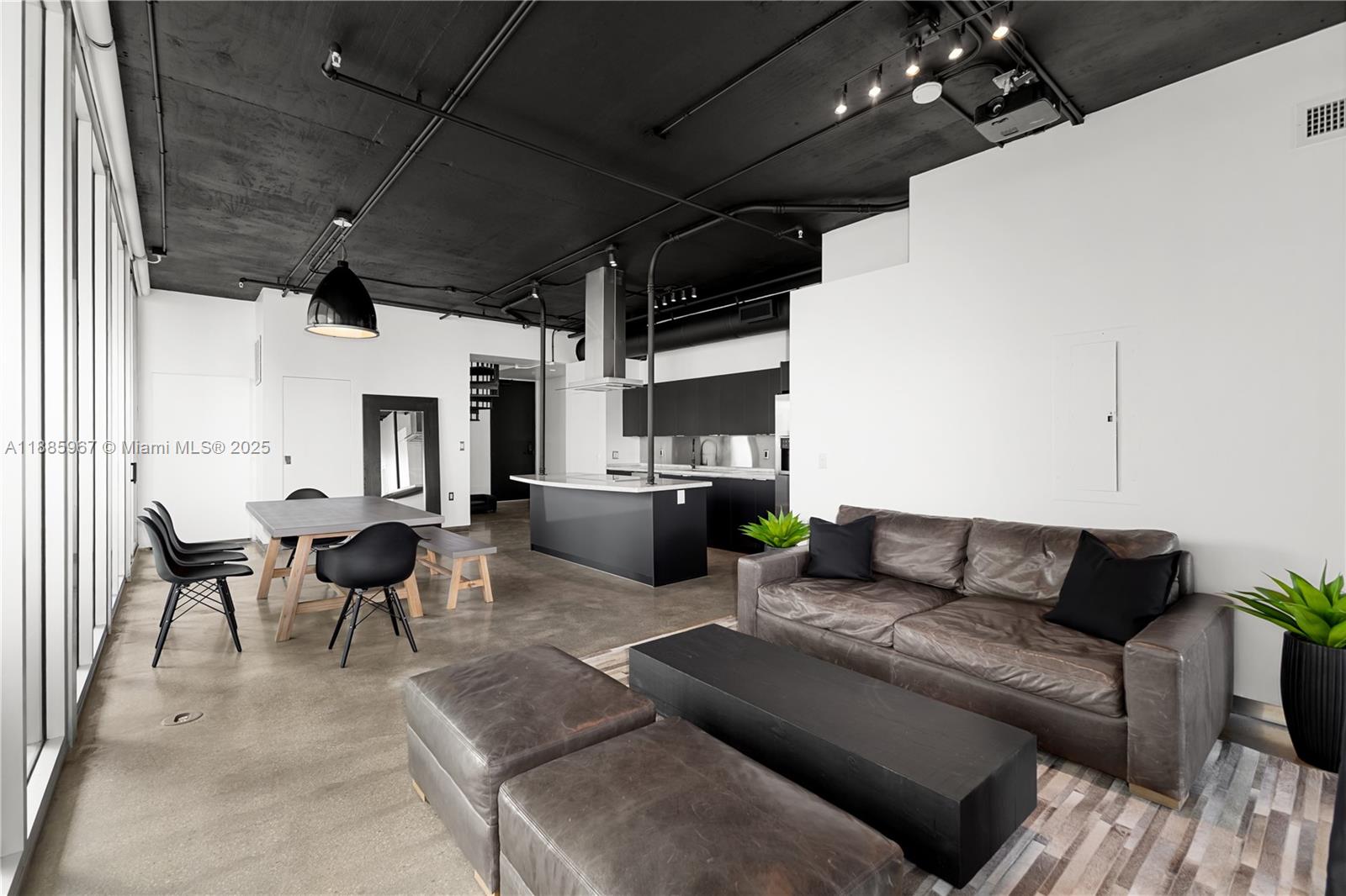 1700 Meridian Avenue, Unit 501 Miami Beach, FL 33139 - Photo 25 of 57 a living room with furniture and a chandelier