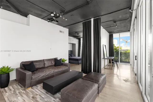a view of a balcony with potted plants
