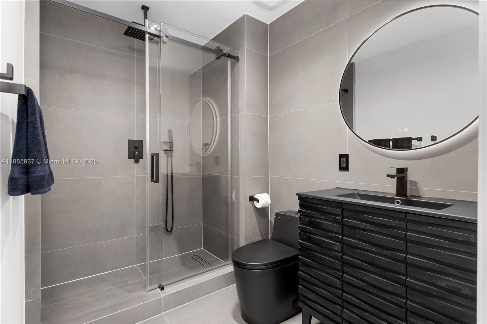 1700 Meridian Avenue, Unit 501 Miami Beach, FL 33139 - Photo 37 of 57 a bathroom with a sink a toilet and shower