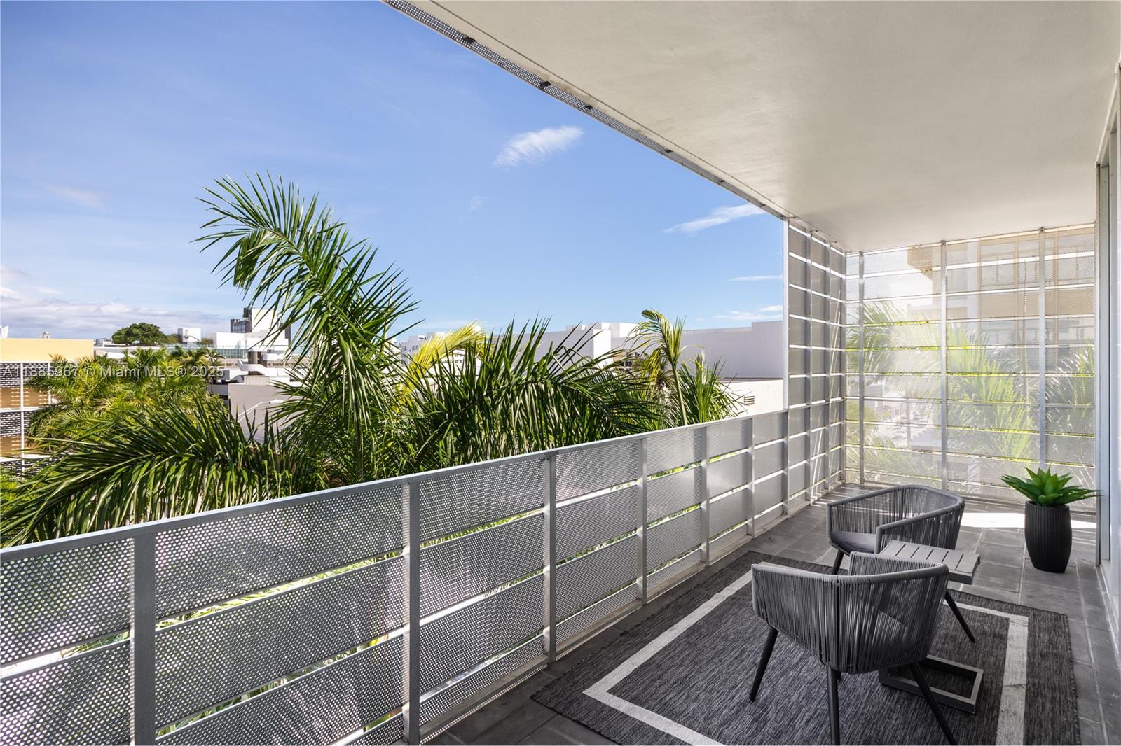 1700 Meridian Avenue, Unit 501 Miami Beach, FL 33139 - Photo 41 of 57 a view of a chair and table in the balcony