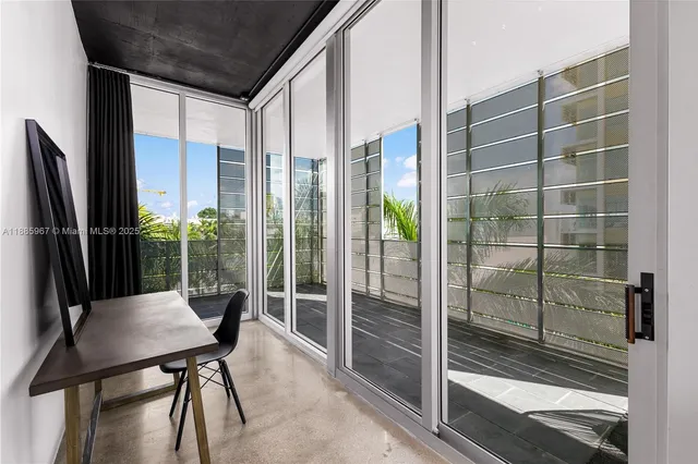 a view of a patio with table and chairs and potted plants