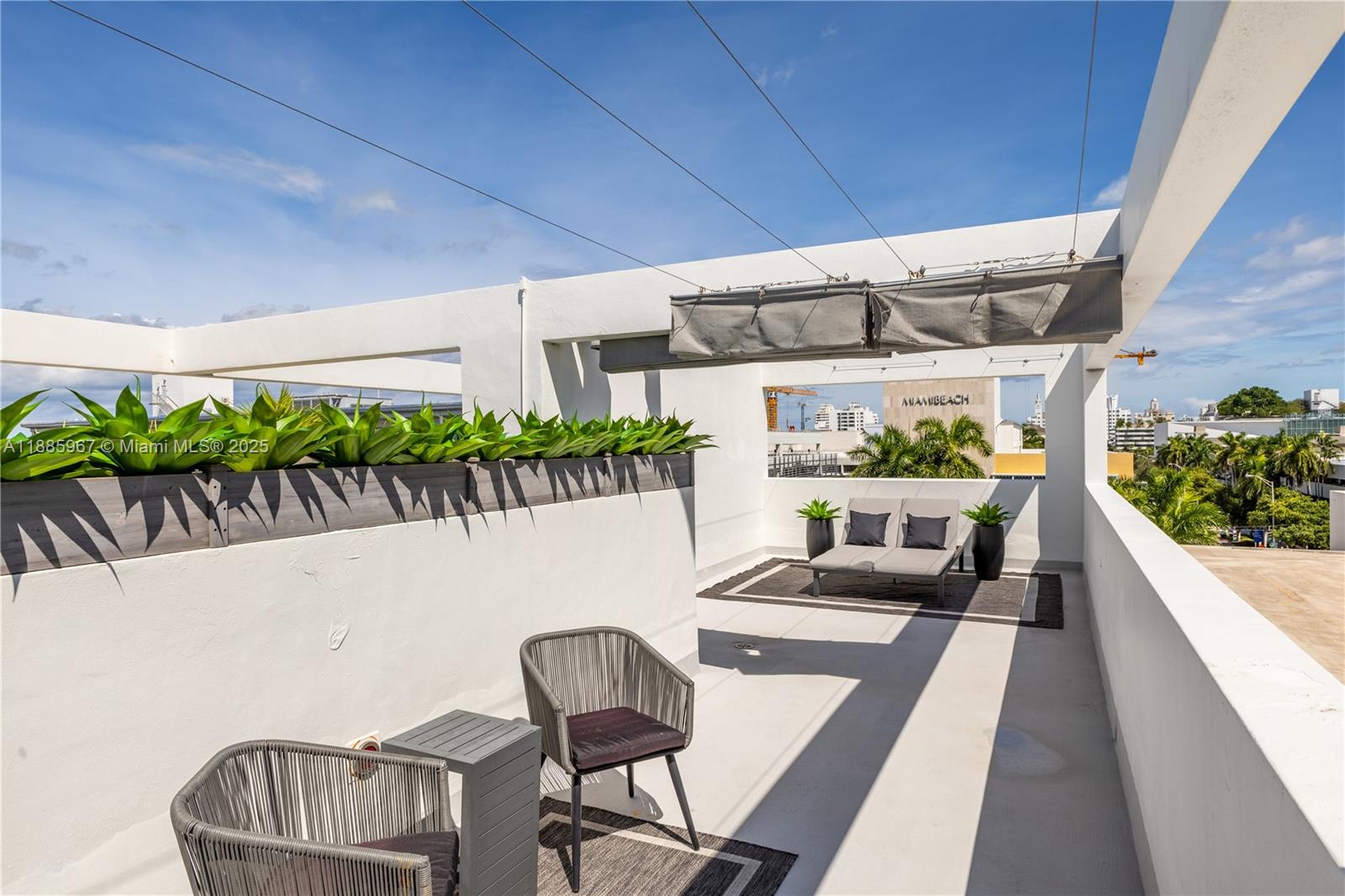 1700 Meridian Avenue, Unit 501 Miami Beach, FL 33139 - Photo 48 of 57 a view of a chairs and table in patio