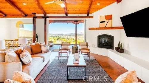 a outdoor space with patio the couches and a fireplace